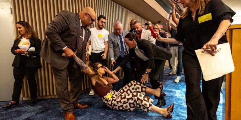 Chaos at Miami-Dade commission as officers bring out objector to new ICE detention arrangement
