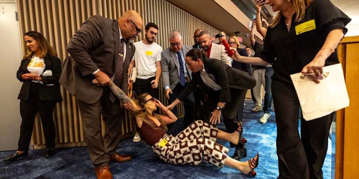 Chaos at Miami-Dade commission as officers bring out objector to new ICE detention arrangement