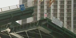 Police Woman injured after falling from the Brickell Avenue Bridge; cop injured while rescuing her