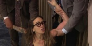 Woman pulled out of the Miami-Dade commission hearing amid intense confusion over the ICE arrangement