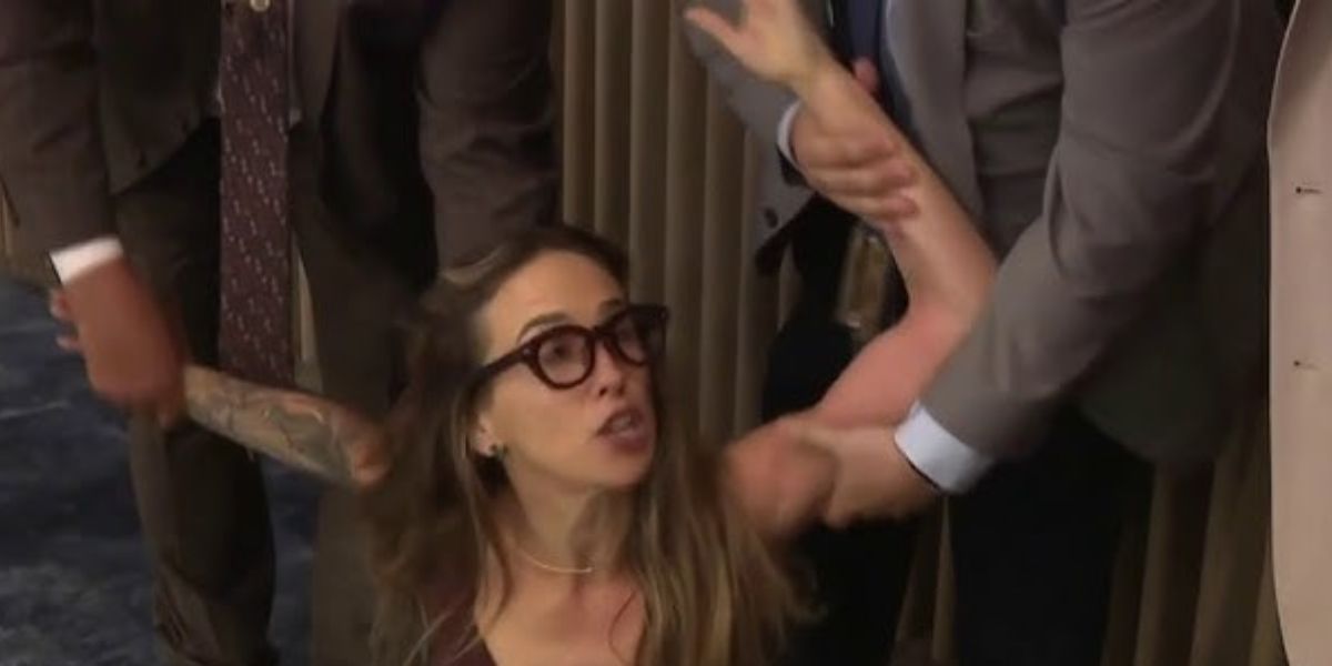 Woman pulled out of the Miami-Dade commission hearing amid intense confusion over the ICE arrangement.